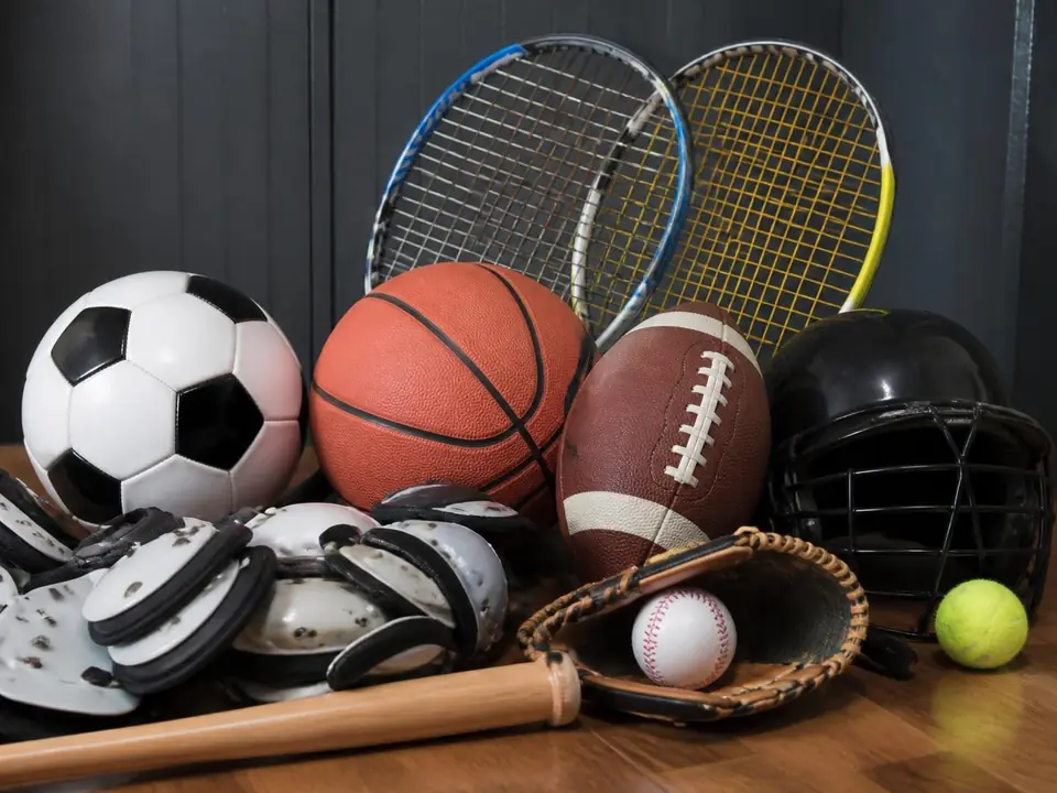 Soccer balls, basketballs, football, tennis rackets and protective gear